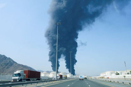 Iran Oil Revenue Surge showing oil exports and ships passing through Strait of Hormuz