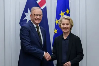 Handshake representing Australia EU trade agreement signing