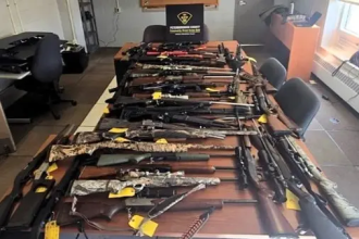 Trent Lakes weapons seizure police display guns and cocaine