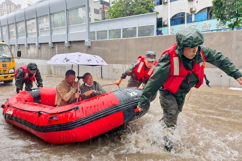 China floods rescue operations evacuating trapped residents