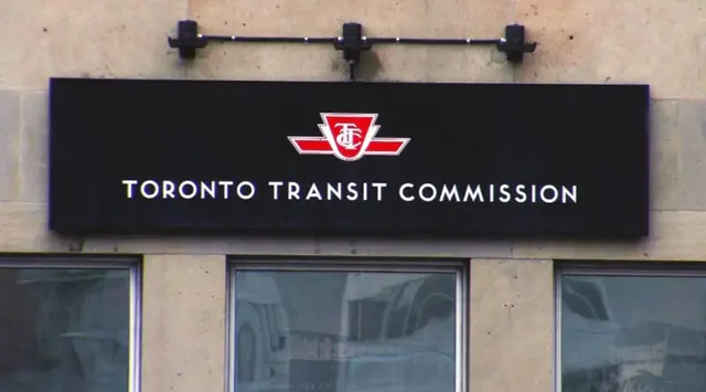 TTC transit workers union agreement meeting in Toronto showing officials and workers signing deal to avoid strike